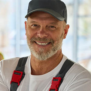 Smiling contractor holding project documents